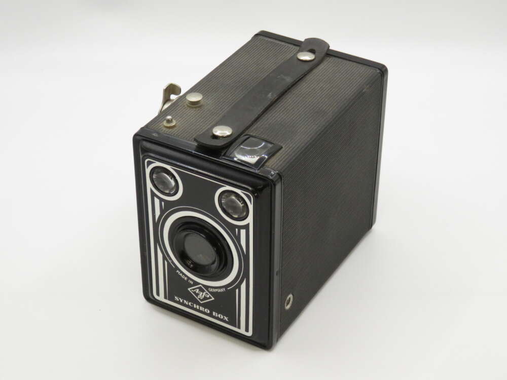 IMG_4035 A vintage black Agfa Synchro Box camera with a strap and retro design features.