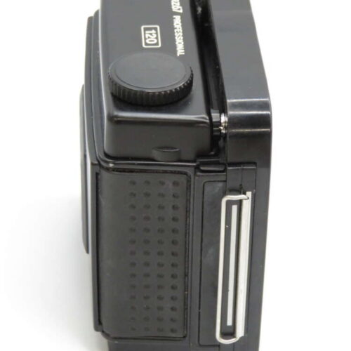 Black film camera with textured grip and "120 Professional" text on the top side.