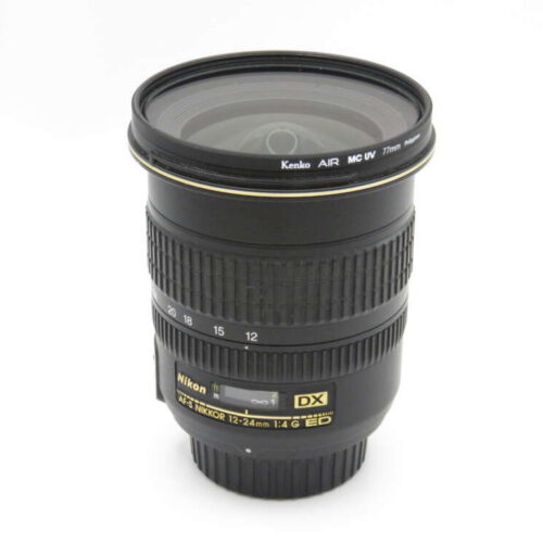 A Nikon DX 12-24mm camera lens with a Kenko AIR MC UV filter attached.