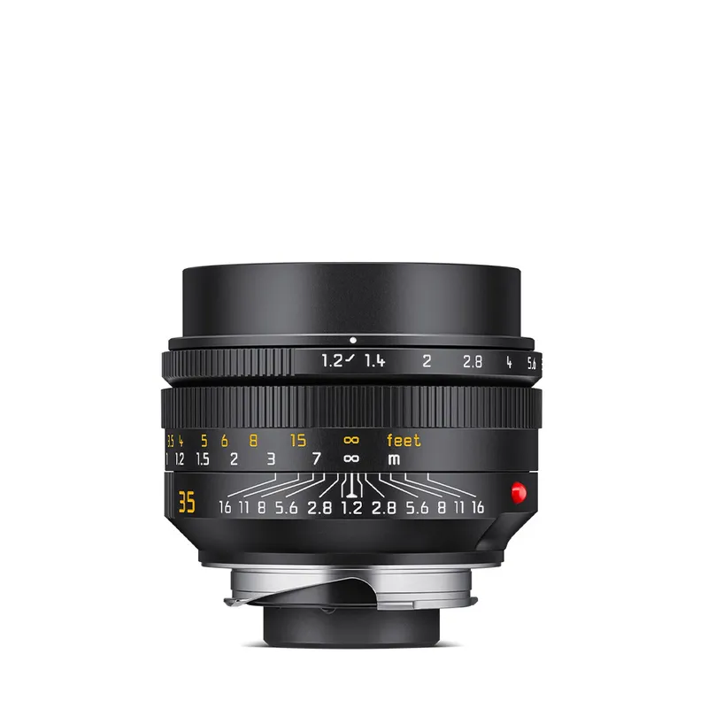 35mm1.2noct A black camera lens with detailed aperture and focus markings on its body, including numbers and lines.