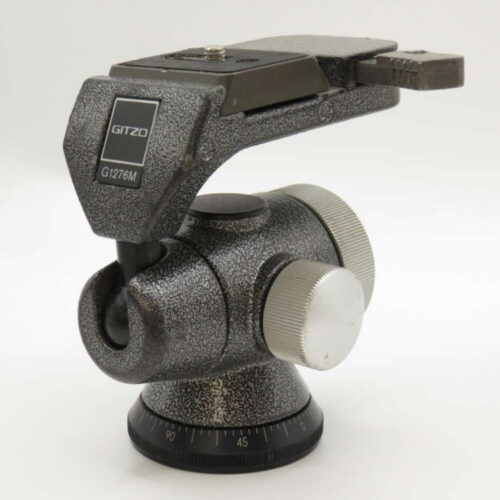 A Gitzo G1276M camera tripod head with a textured finish, showing adjustment knobs and angle markings.