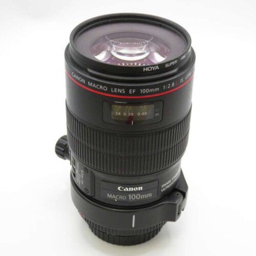 Canon Macro Lens EF 100mm with a Hoya filter attached, featuring focus and distance scales.