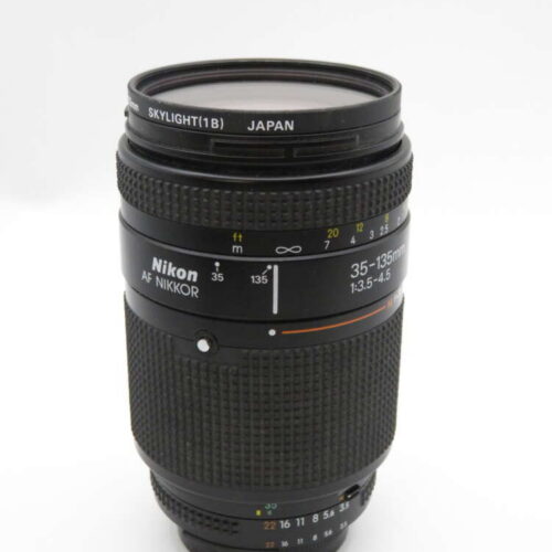 A Nikon AF Nikkor 35-135mm camera lens with a Skylight filter attached, showing its focal range markings.