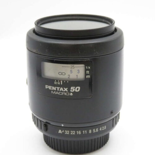 Pentax 50mm macro camera lens with focus scale and aperture markings.