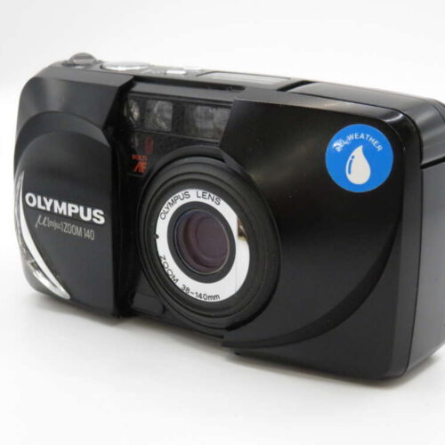 A black Olympus Mju Zoom 140 film camera with a large lens and a blue weatherproof sticker.