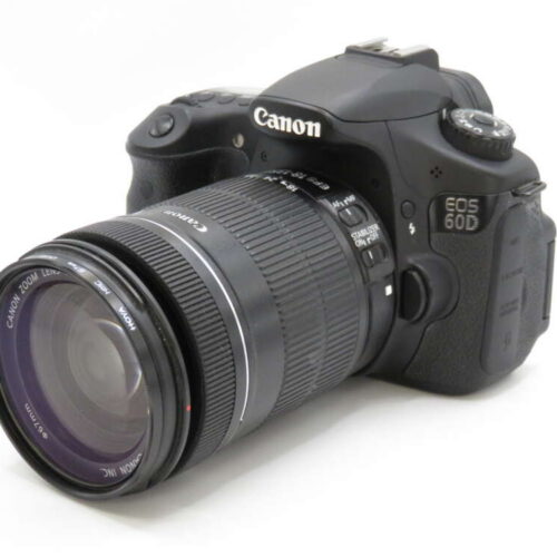 A Canon EOS 60D DSLR camera with a zoom lens attached, viewed from the front-left angle.