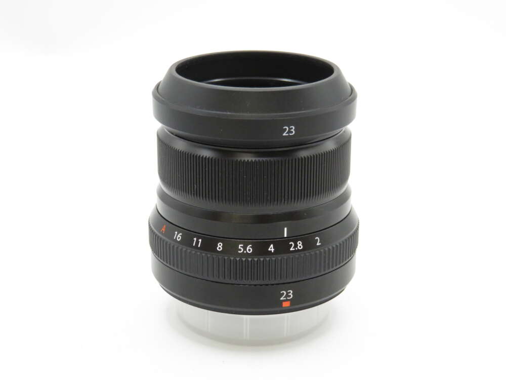 IMG_4202 A black camera lens with a focus ring and aperture markings from F16 to F1.4, labelled with the number 23.