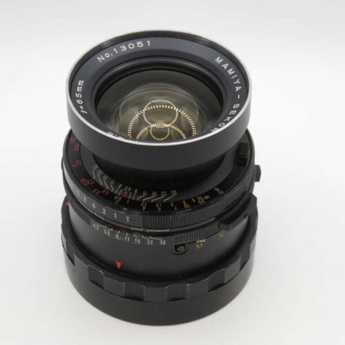 Black camera lens with silver details, engraved numbers, and red markings on a white background.