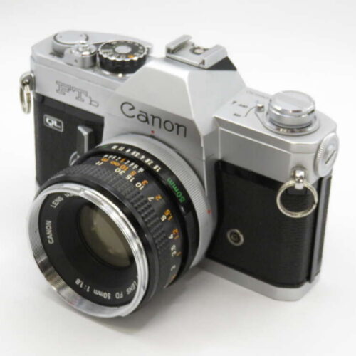 A vintage Canon FTb QL film camera with a silver and black body and a Canon FD 50mm lens attached.