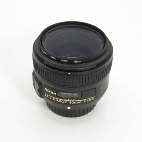 Nikon AF-S NIKKOR 50mm f/1.8G lens on a white background.