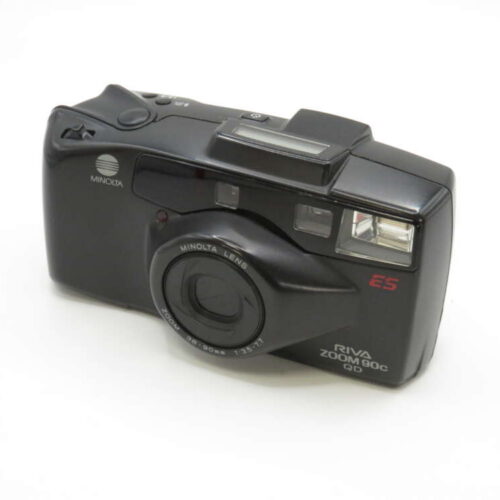 A black Minolta Riva Zoom 90c film camera with a built-in flash and lens zoom ring.