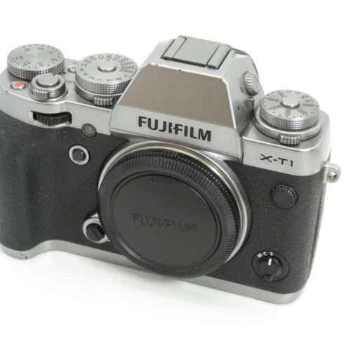 Fujifilm X-T1 camera body with vintage-style design and dials, shown without a lens attached.