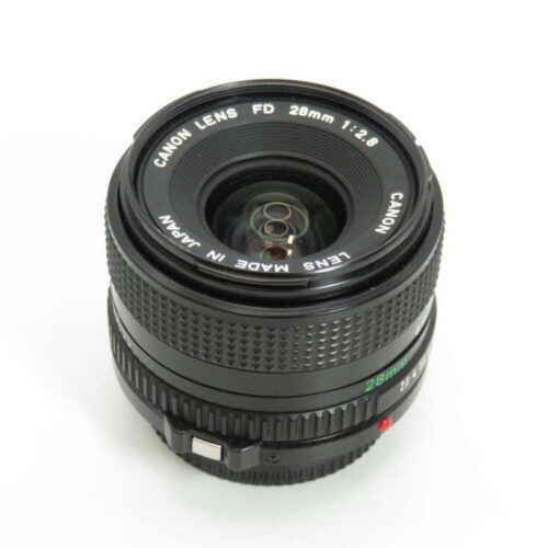 A Canon FD 28mm f/2.8 lens with visible markings including "Lens Made in Japan".