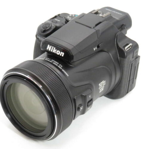 A black Nikon digital camera with a large lens and 125x optical zoom feature is shown against a white background.
