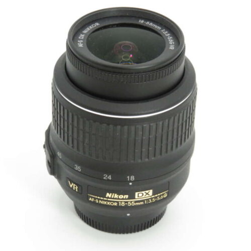 A Nikon DX VR lens with an 18-55mm focal range and f/3.5-5.6 aperture, featuring focus and zoom rings.